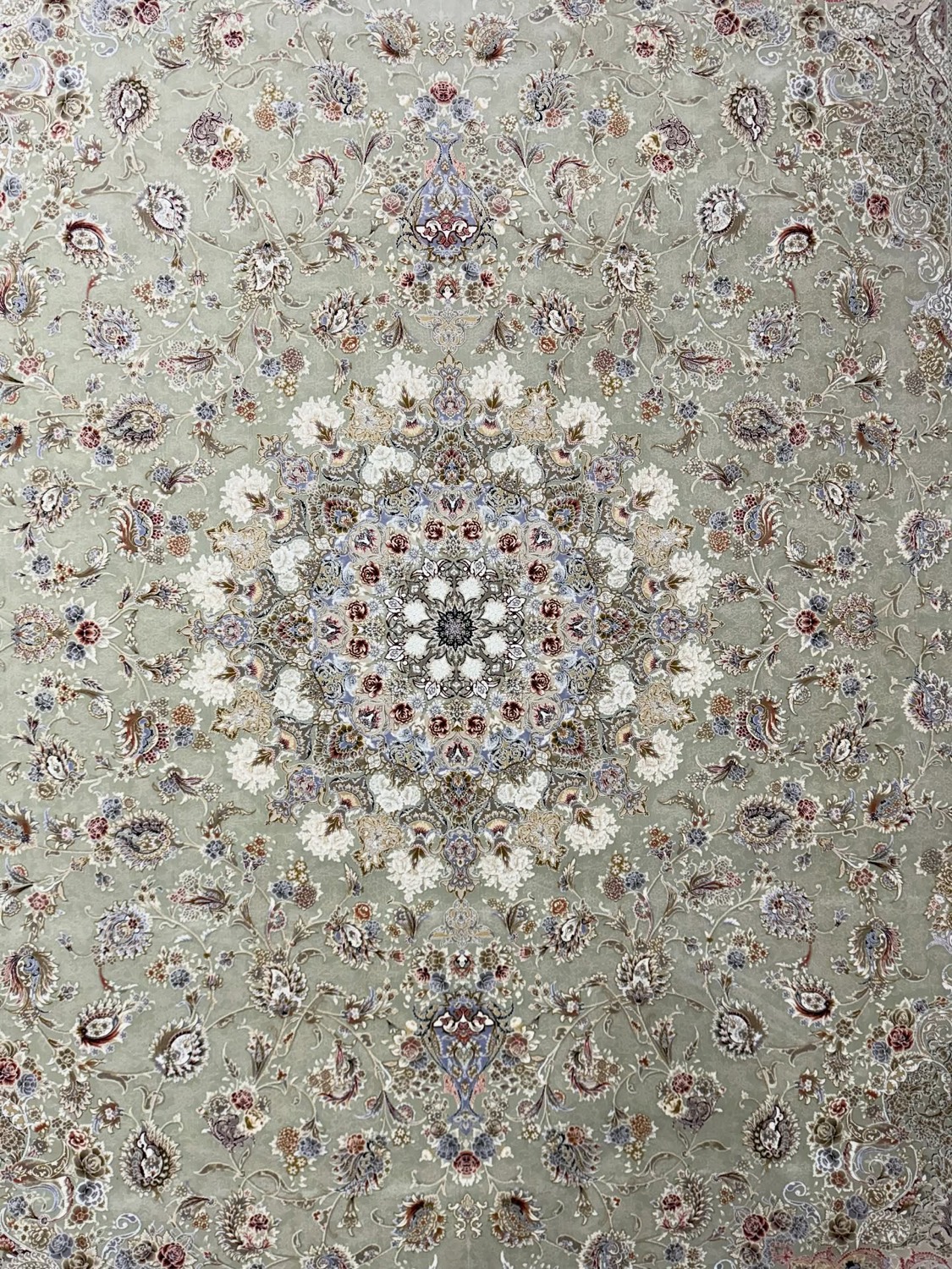 A finely woven Persian rug with an intricate central medallion
